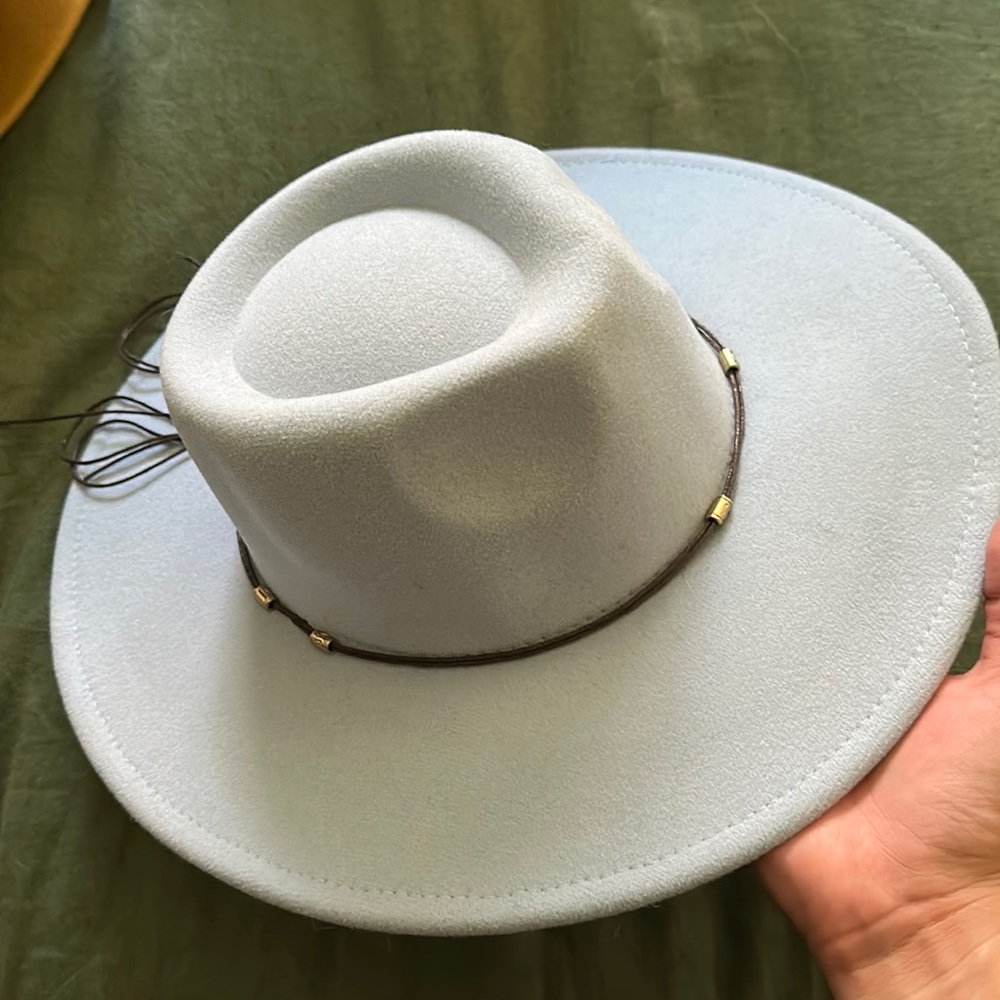 Light blue fedora hat with leather detail.